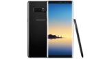 Black Samsung Galaxy Note 8 smartphone with large curved display showing scenic image of people standing on lake dock at sunset or sunrise, with included stylus pen demonstrating mobile device’s multimedia and productivity capabilities.