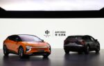 Two futuristic electric concept cars, one bright orange and the other matte black, showcasing sleek aerodynamic designs and innovative automotive technology from a Chinese automaker.